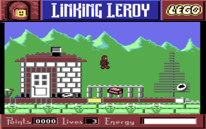 A screenshot of a Commodore 64 game. The gameplay window shows Leroy, a red LEGO astronaut, jumping in a LEGO world. The world contains a number of LEGO structures and elements set in front of a mountainous background. Above the game window is a title bar with the text "Linking Leroy", with Leroy's head to the left and the LEGO logo to the right. Below is a points counter, a lives counter, and a health bar.